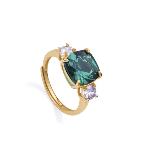 Elegant gold ring with a large green gemstone, flanked by smaller clear stones.
