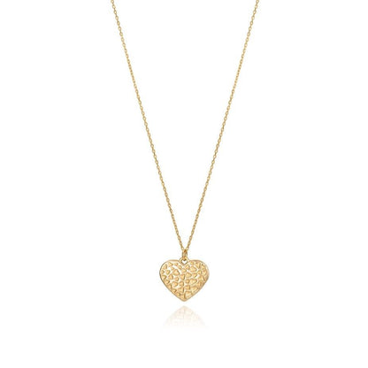 Heart-shaped gold necklace pendant on a thin chain with a delicate pattern, showcasing elegant design jewelry piece.