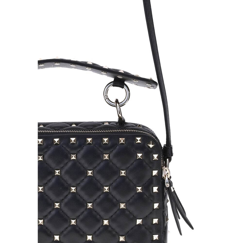 Valentino Garavani Black Lamb Ovis Aries Aries Shoulder Bag with gold-tone Rockstud studs and removable leather handle detail.