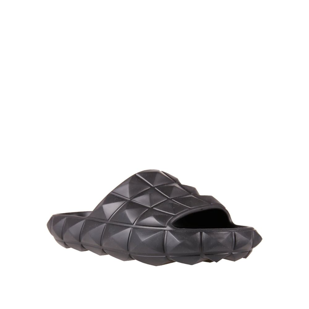 Valentino Garavani Black Rubber Slippers with round open toe and all-over rubber studs, men's footwear, made in Italy.