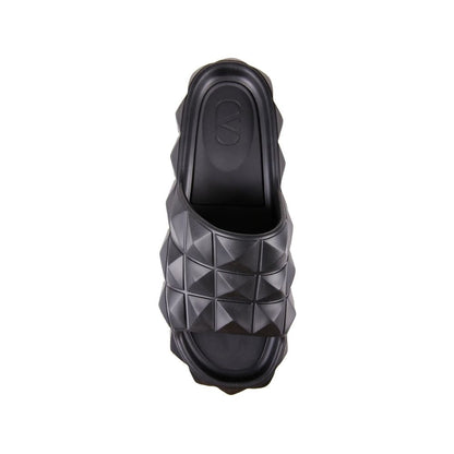 Valentino Garavani Black Rubber Slippers with all-over stud design, round and open toe, made in Italy for men.