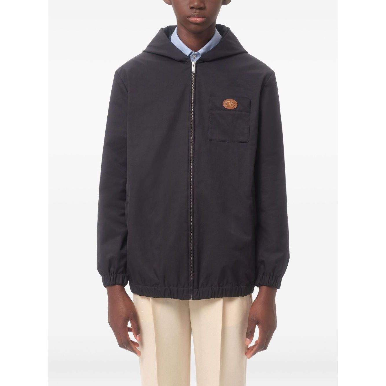 Valentino Nylon Hooded Jacket with VLogo Patch, navy blue zip-up with classic hood, chest patch pocket, and VLogo Signature emblem.