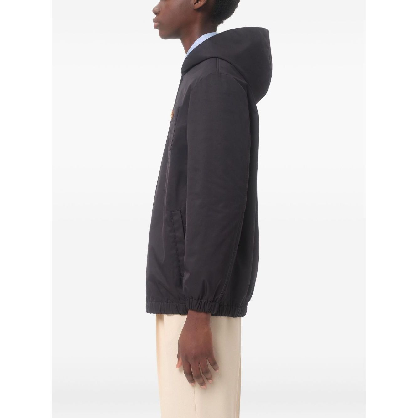 Valentino Nylon Hooded Jacket with VLogo Patch in navy blue, featuring zip fastening and chest patch pocket, side view.