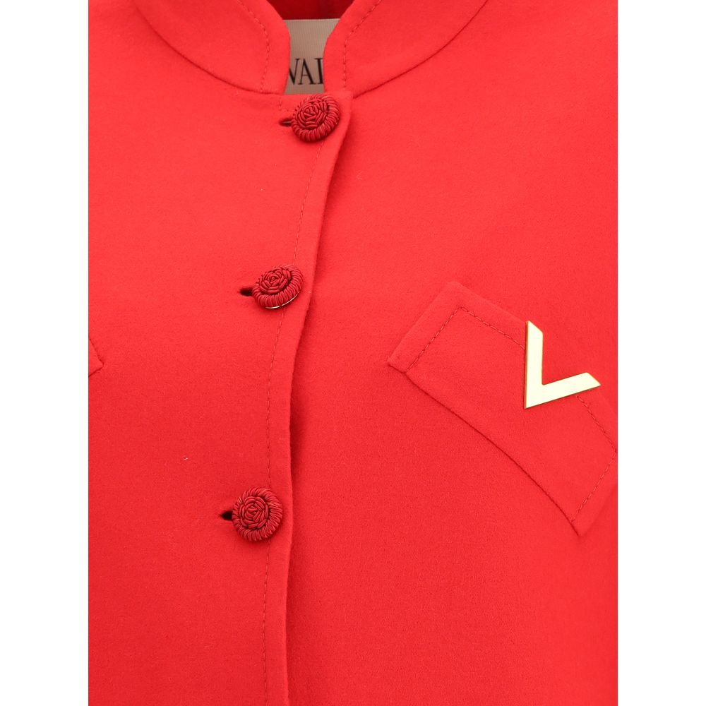 Close-up of Valentino Red Fleece Wool Coat showing soutache buttons and golden VLogo on pocket