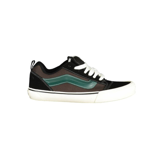 Vans Black Leather Men Sneaker with green contrast, iconic logo, and white sole, showcasing street style and comfort.