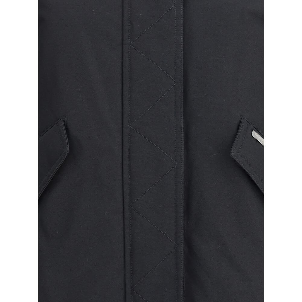 Close-up of Woolrich Black Cotton Shell Jacket showing front closure with double-slider zipper and flap pockets for Fall/Winter season.