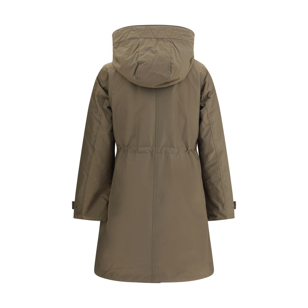 Back view of Woolrich Green Cotton Parka with hood, showcasing quilted design and adjustable button cuffs, featuring double-layer decomposable style.