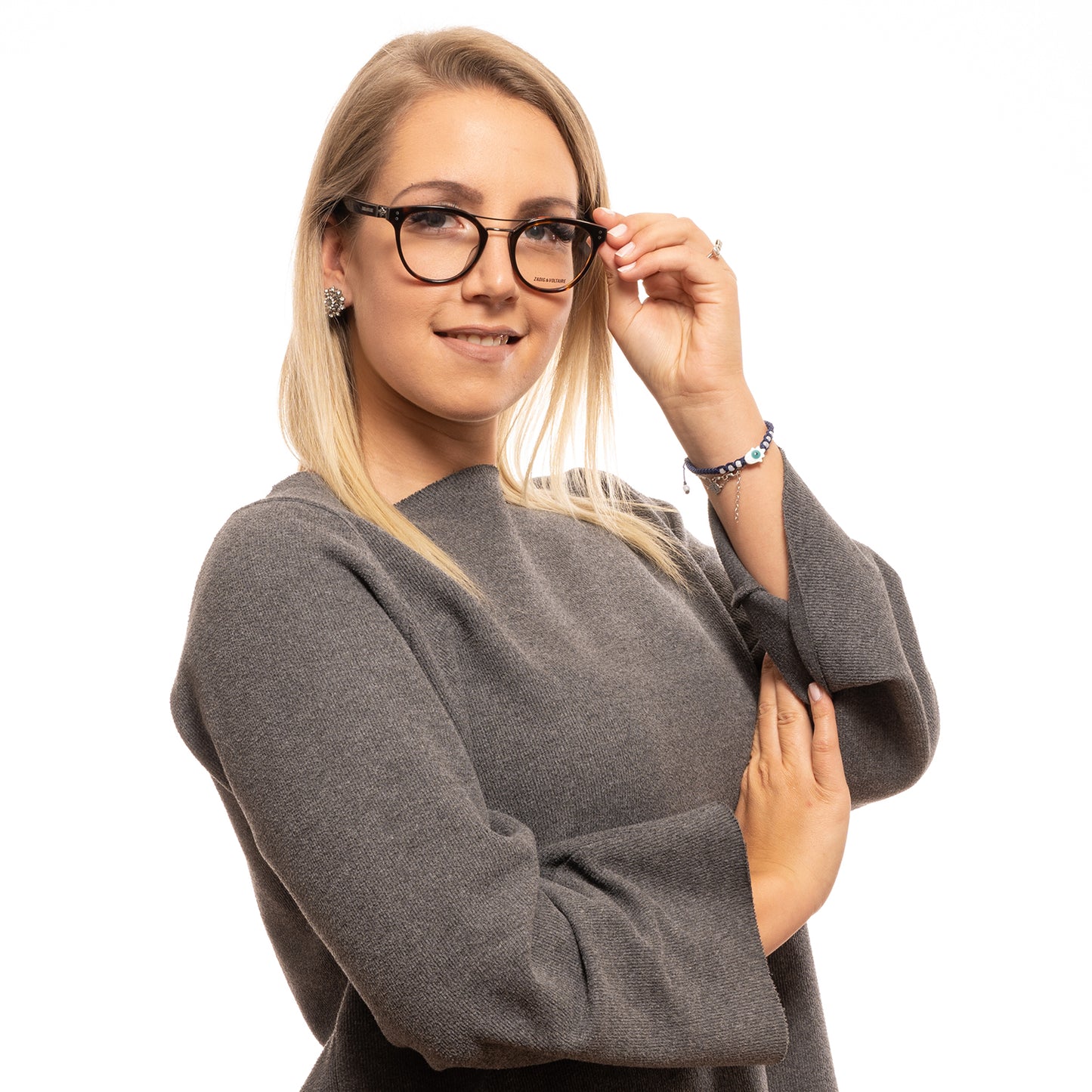 Lady wearing ZADIG & VOLTAIRE MOD. VZV217 490743 glasses, stylish and confident look